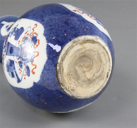 An unusual Chinese powder blue ground bottle vase, Kangxi period, height 20cm, gilding worn